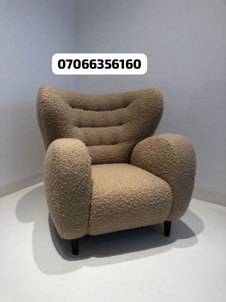 Beige boucle wingback chair