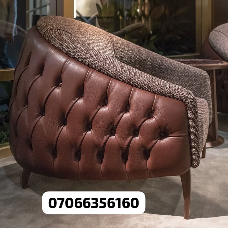 Brown tufted leather armchair