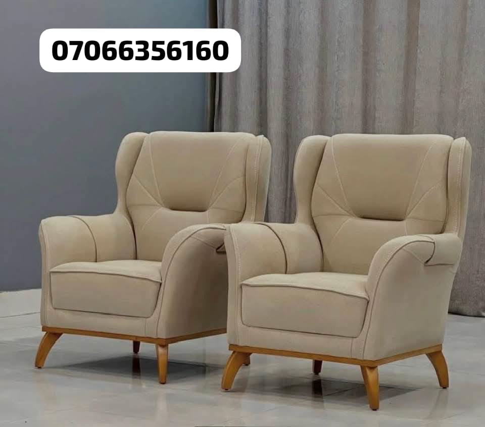 Pair of beige wingback chairs